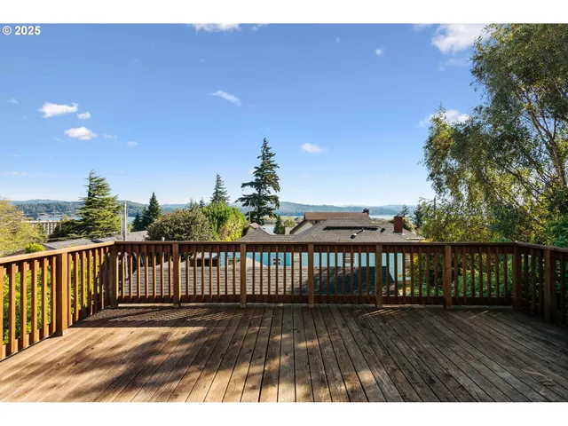 a view of balcony with wooden floor