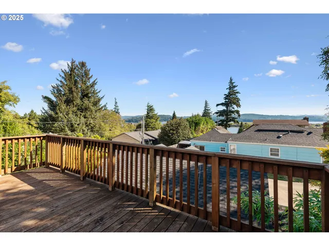 a view of a balcony with wooden floor