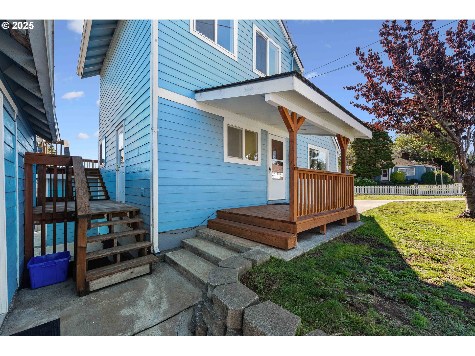 584 Exchange Street North Bend, OR 97459 - Photo 48 of 48 a view of a house with backyard and a barbeque