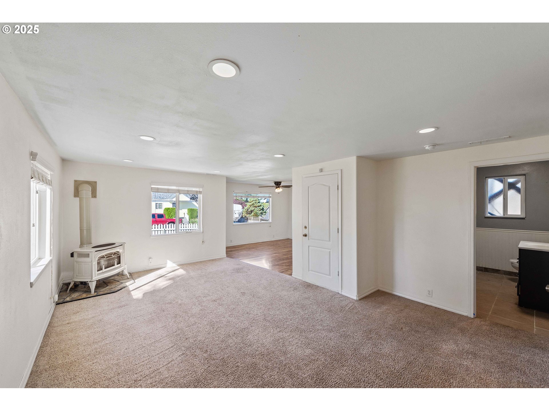 584 Exchange Street North Bend, OR 97459 - Photo 6 of 48 a view of a livingroom with furniture and a flat screen tv