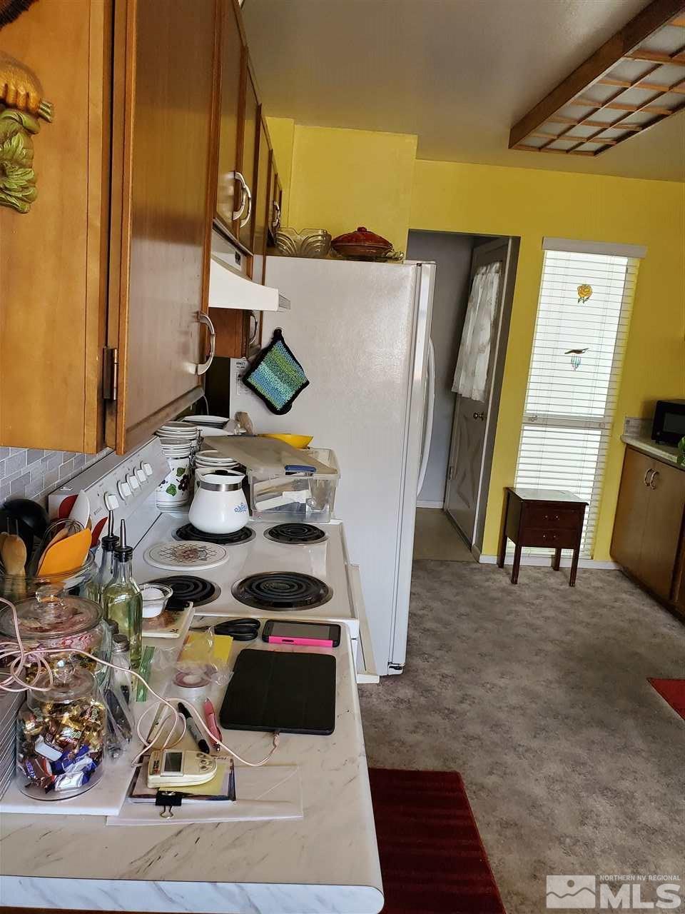 3440 Rauscher Drive Reno, NV 89503 - Photo 8 of 8 a black and white photo of a table and chairs in a room