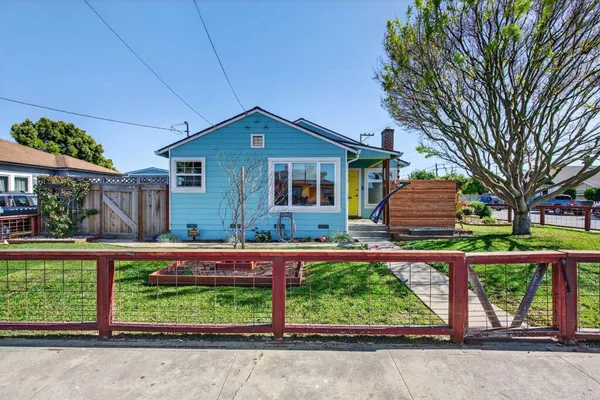 front view of a house with a yard
