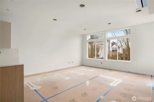 a view of an empty room with a window
