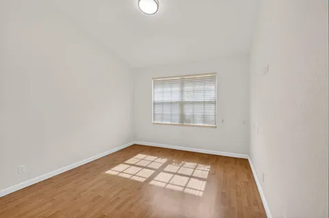 a view of outdoor space with wooden floor