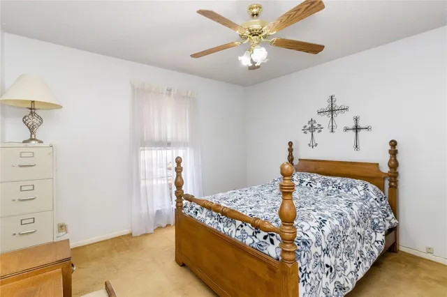 a living room with a bed and a dresser