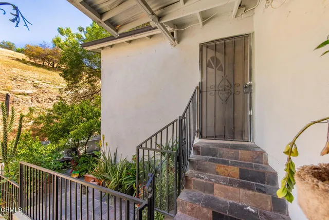 a view of a room with gym equipment and a large window