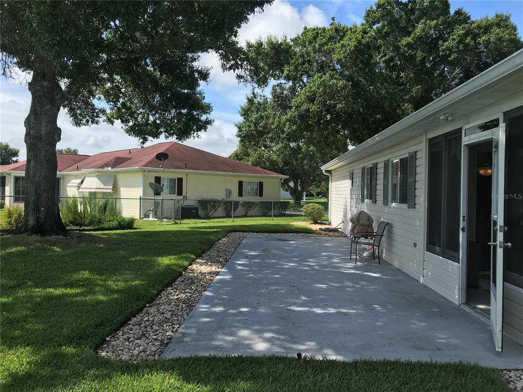 11879 Southwest 137th Loop Dunnellon, FL 34432 - Photo 6 of 37 a front view of a house with garden