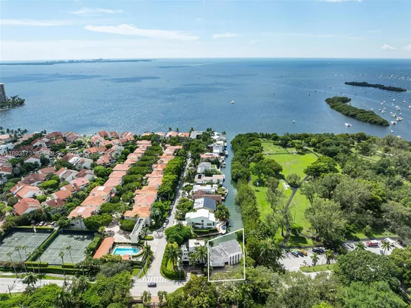 an aerial view of residential building and lake