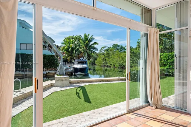 a view of a chair and tables in the balcony
