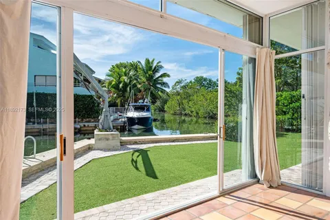 a view of a chair and tables in the balcony