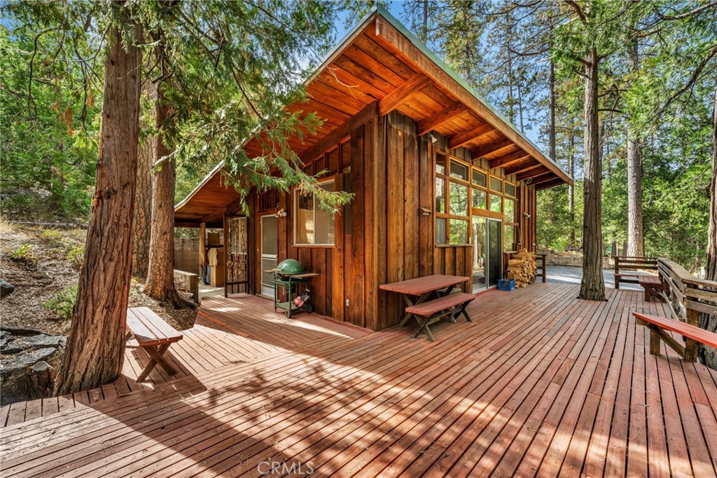 52555 Idyllmont Road Idyllwild, CA 92549 - Photo 1 of 1 a view of backyard with a deck and wooden floor