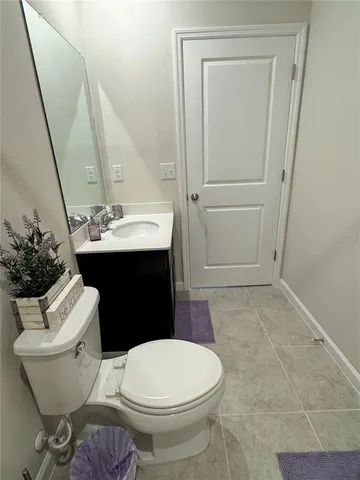 a bathroom with a toilet a sink and tub