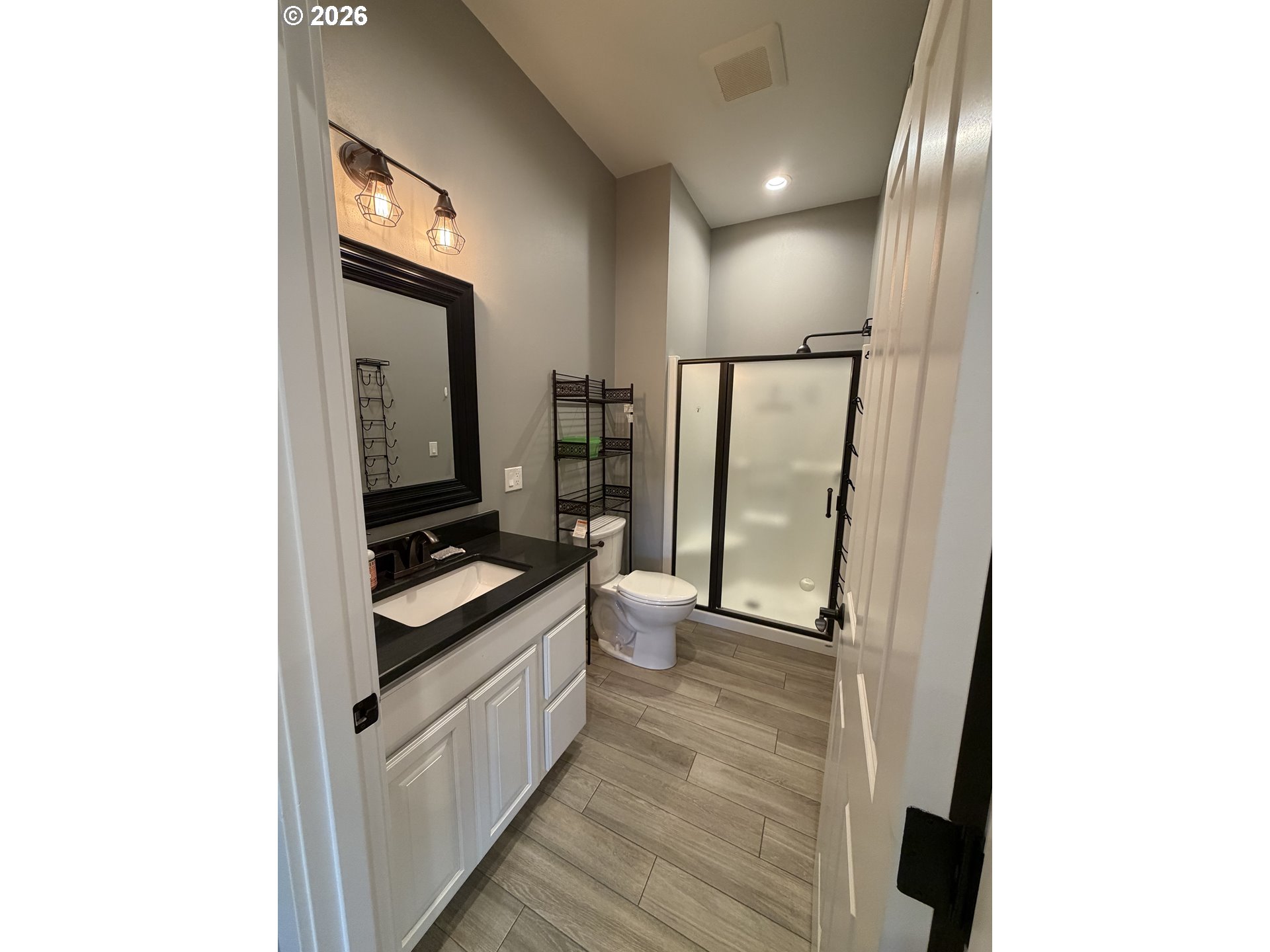 788 Patrick Street Coos Bay, OR 97420 - Photo 12 of 28 a bathroom with a sink a toilet and shower