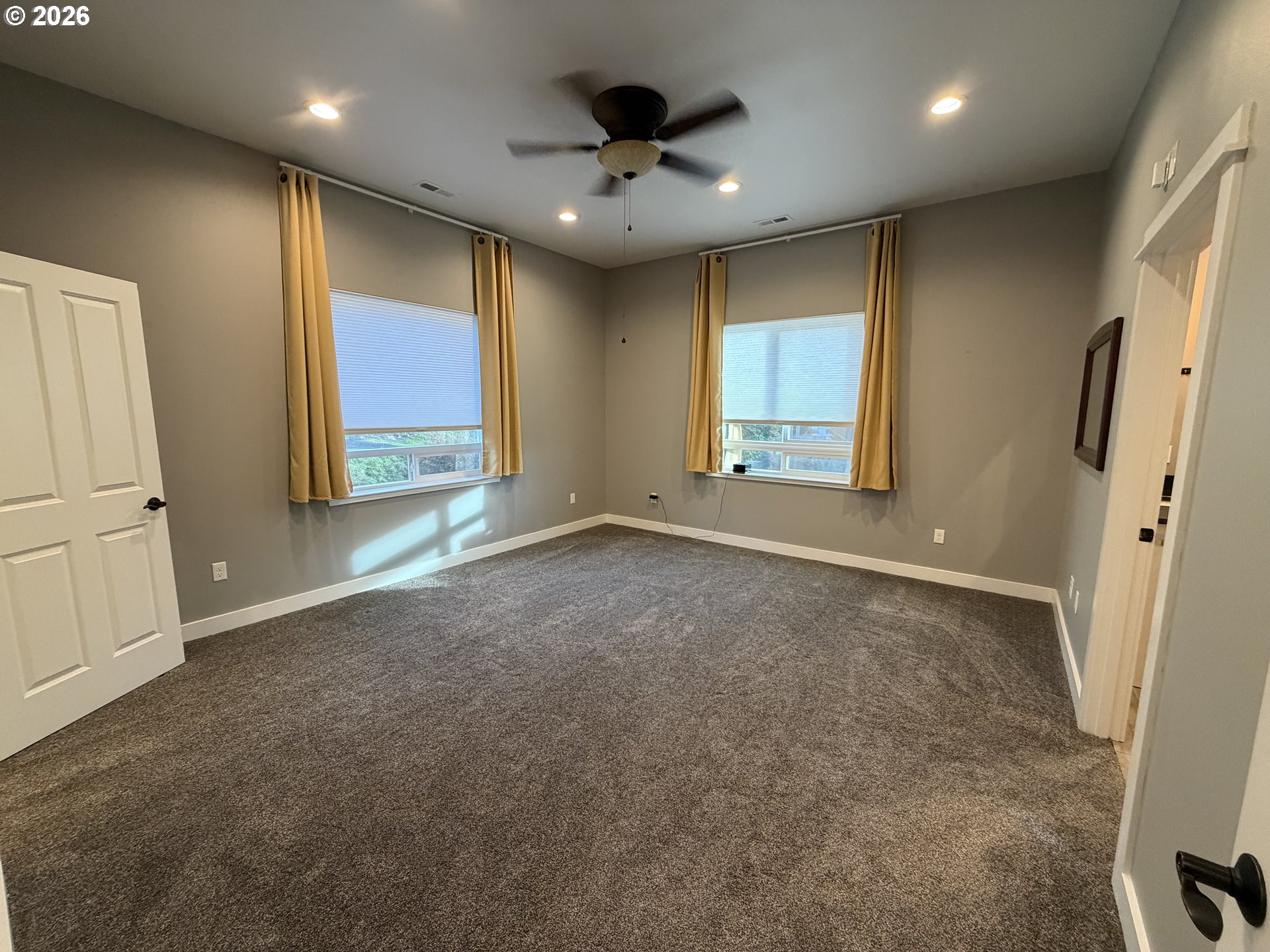 788 Patrick Street Coos Bay, OR 97420 - Photo 15 of 28 an empty room with windows and cabinet