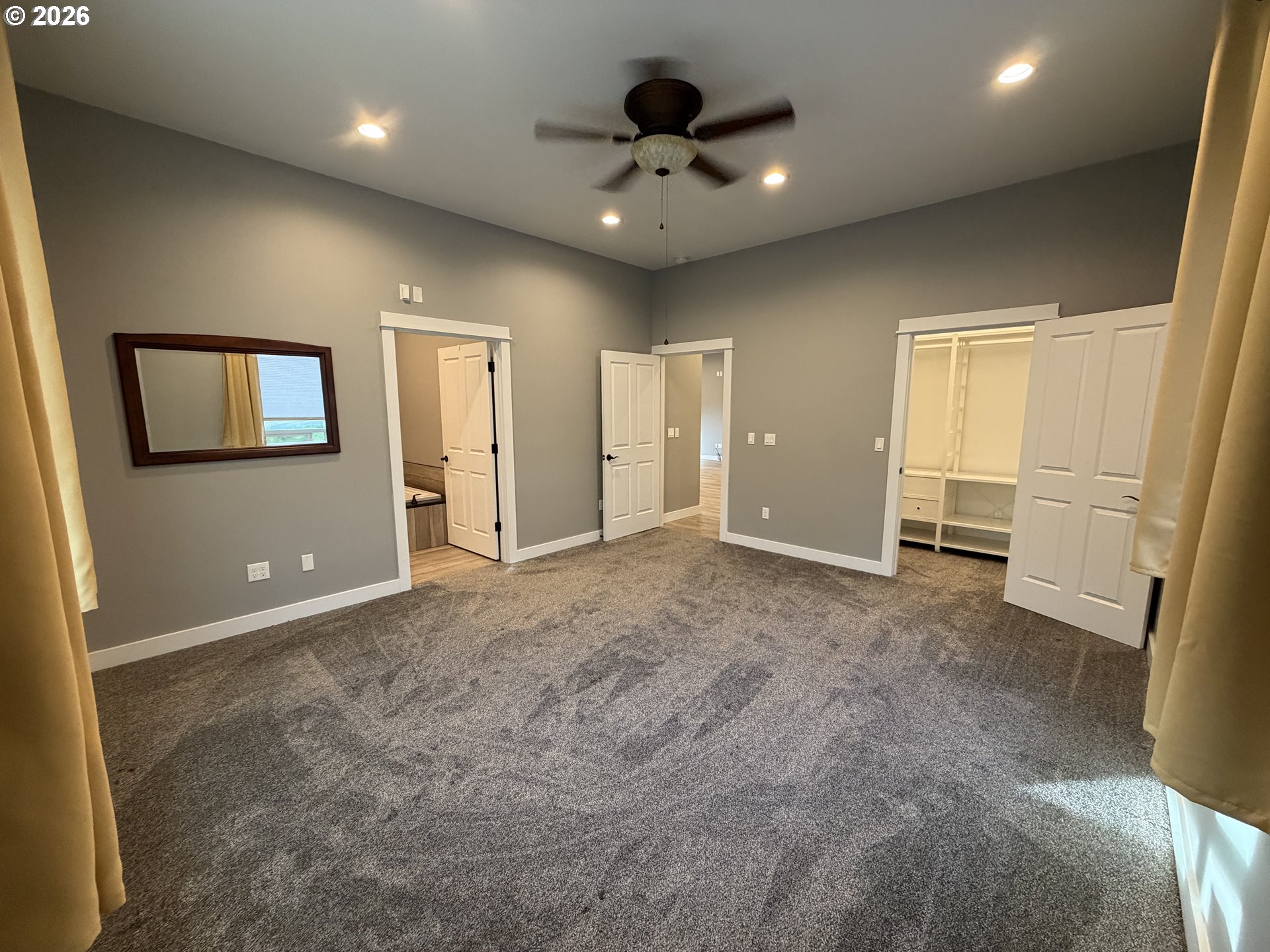 788 Patrick Street Coos Bay, OR 97420 - Photo 16 of 28 a view of a livingroom with a ceiling fan window and a kitchen