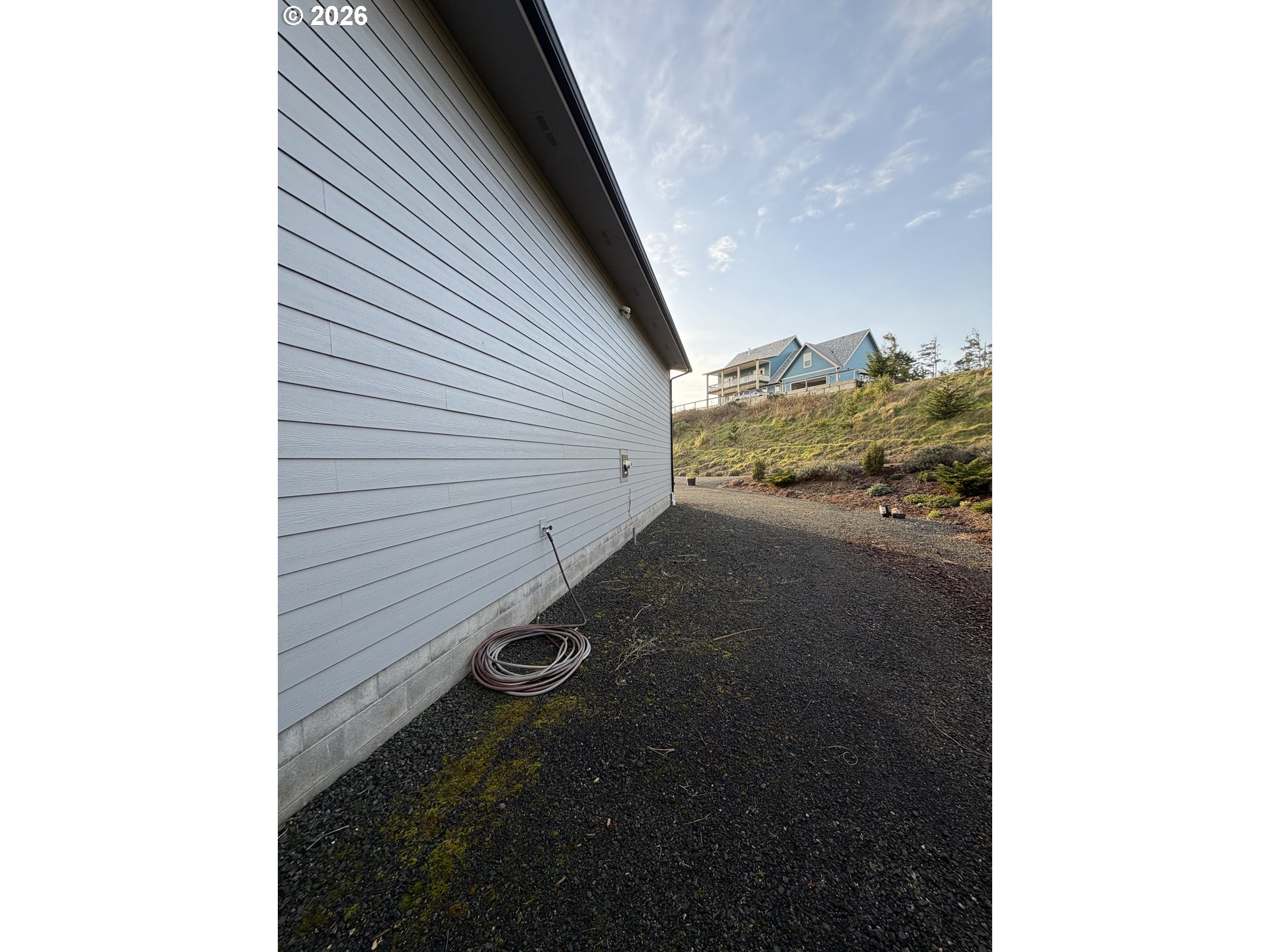788 Patrick Street Coos Bay, OR 97420 - Photo 25 of 28 a view of a house with a yard