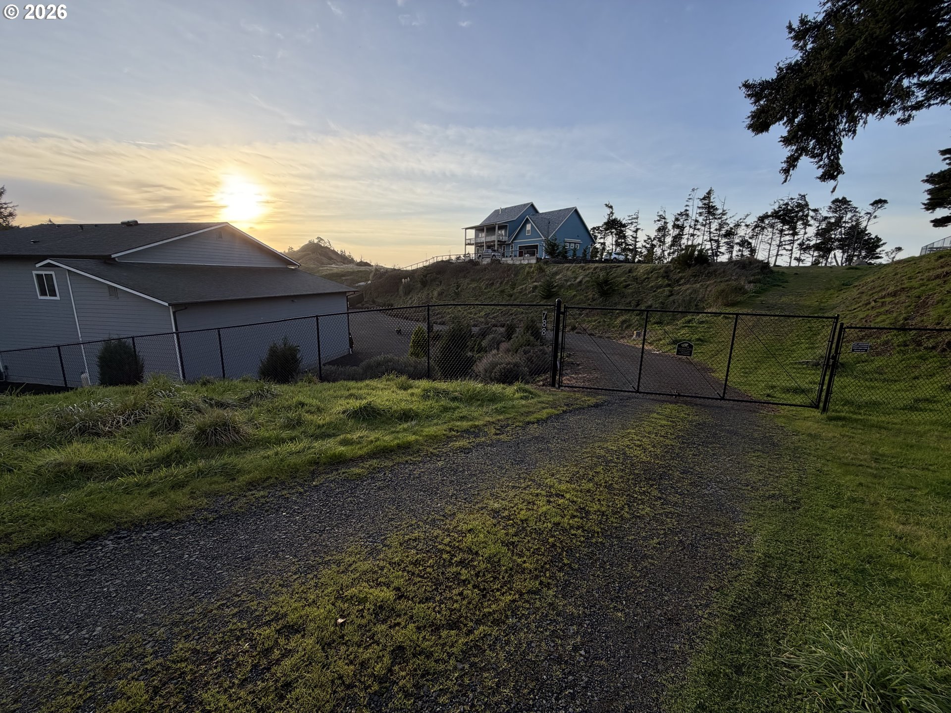 788 Patrick Street Coos Bay, OR 97420 - Photo 28 of 28 a view of a house with a garden