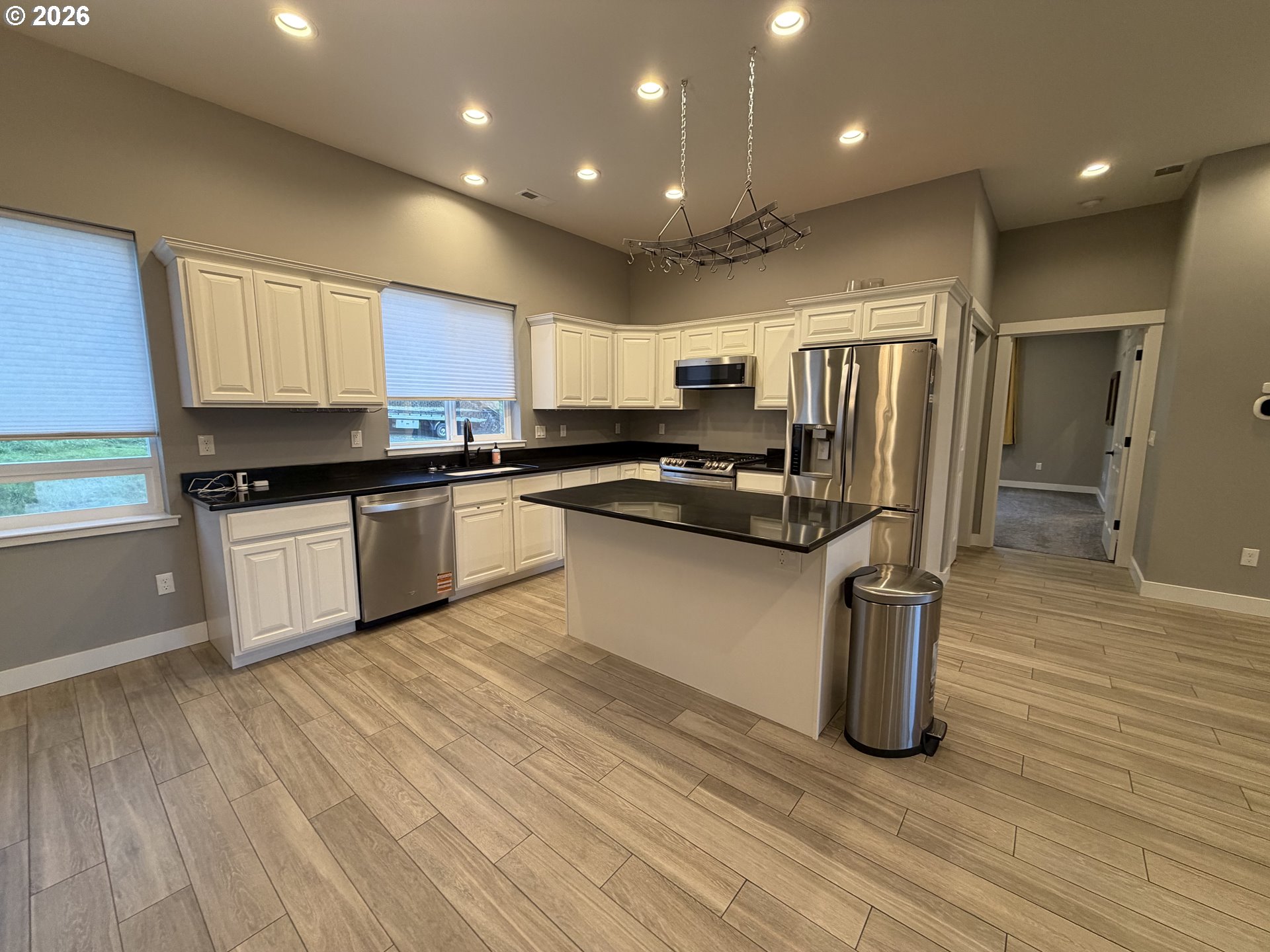 788 Patrick Street Coos Bay, OR 97420 - Photo 6 of 28 a kitchen with stainless steel appliances granite countertop a refrigerator sink and cabinets