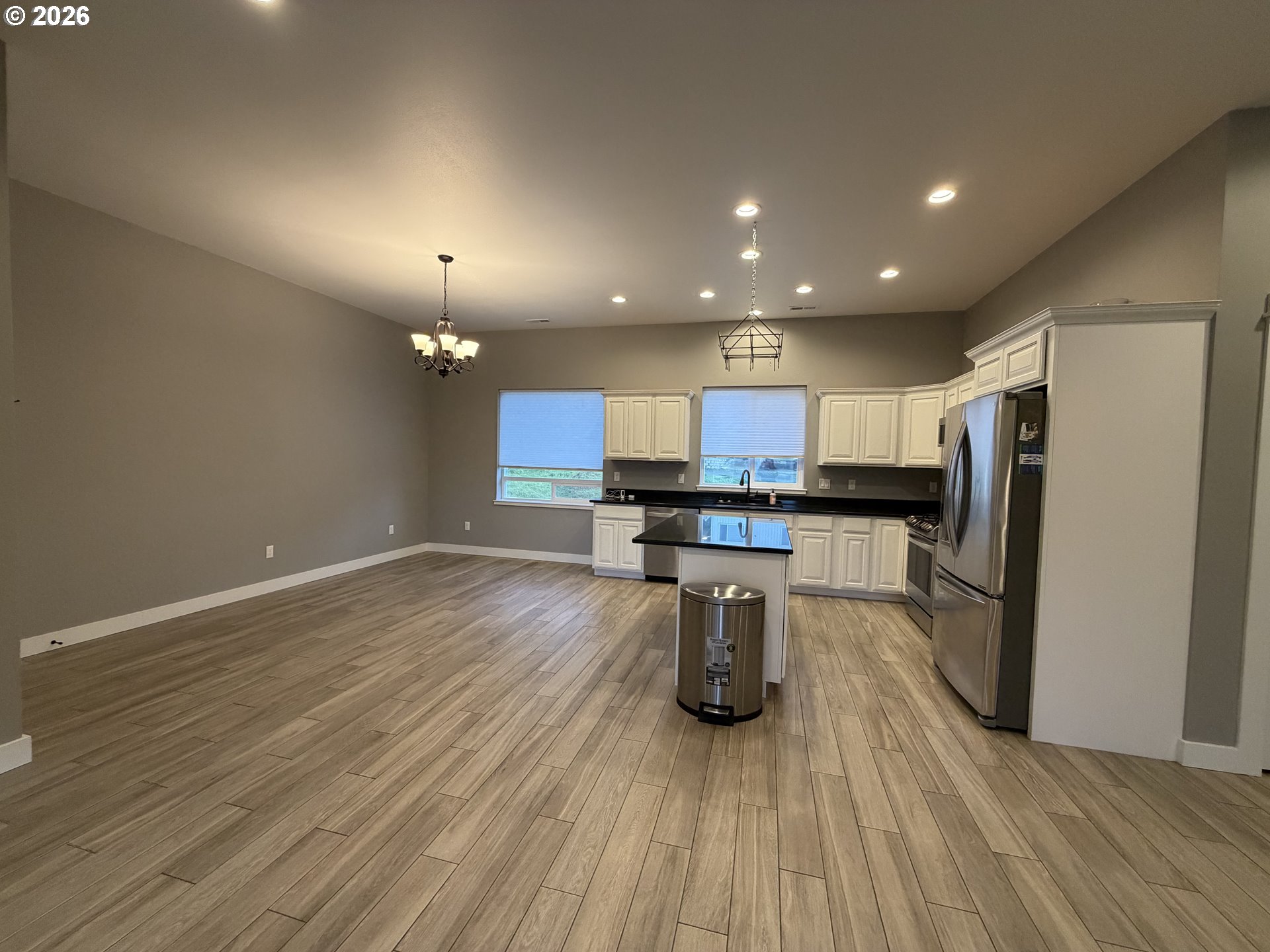 788 Patrick Street Coos Bay, OR 97420 - Photo 7 of 28 an open kitchen with kitchen island and stainless steel appliances