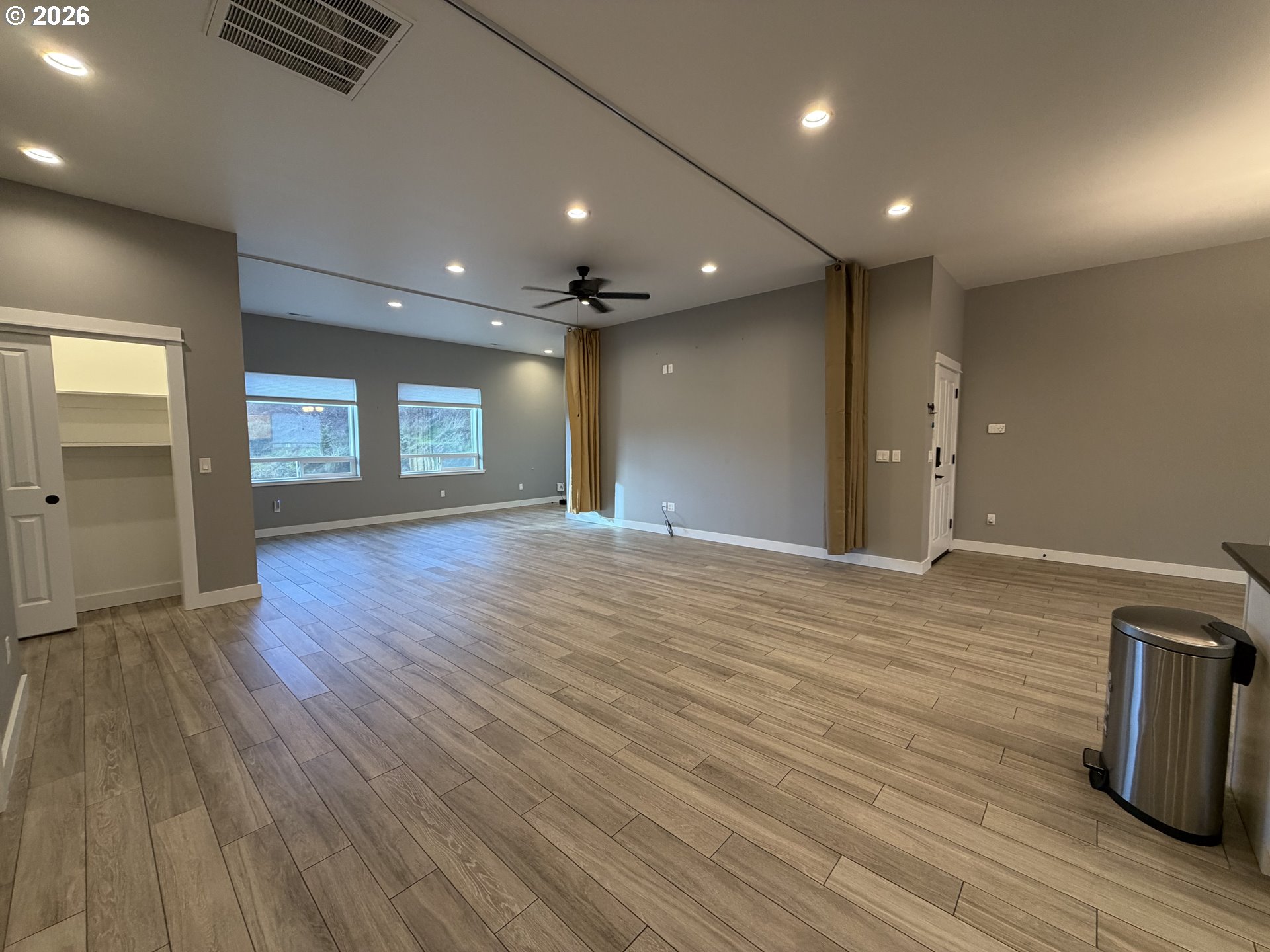 788 Patrick Street Coos Bay, OR 97420 - Photo 8 of 28 a view of an empty room with wooden floor and a window