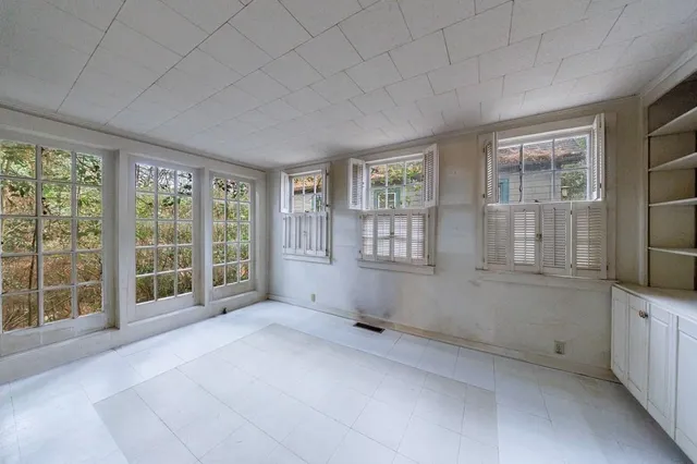 an empty room with windows