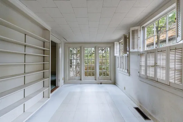 a view of an empty room with a window