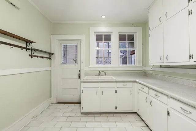 a kitchen with a sink and cabinets