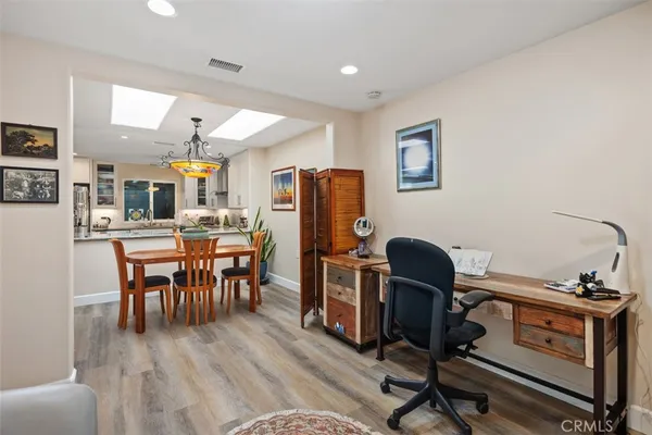 a view of a workspace with furniture and a workspace