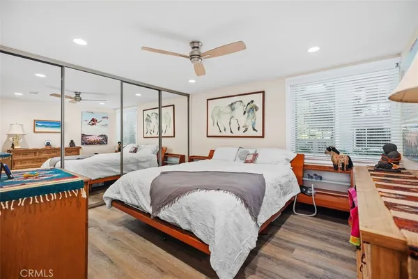 a bedroom with bed and window
