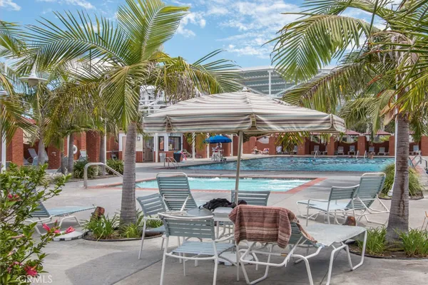 a view of a swimming pool with an outdoor seating