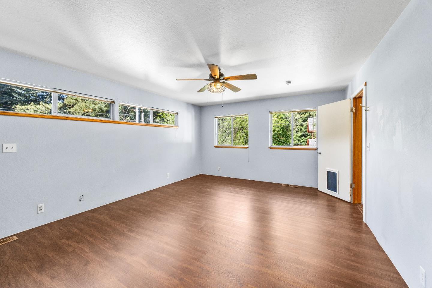 15666 Kings Creek Road Boulder Creek, CA 95006 - Photo 12 of 40 wooden floor in an empty room with a window