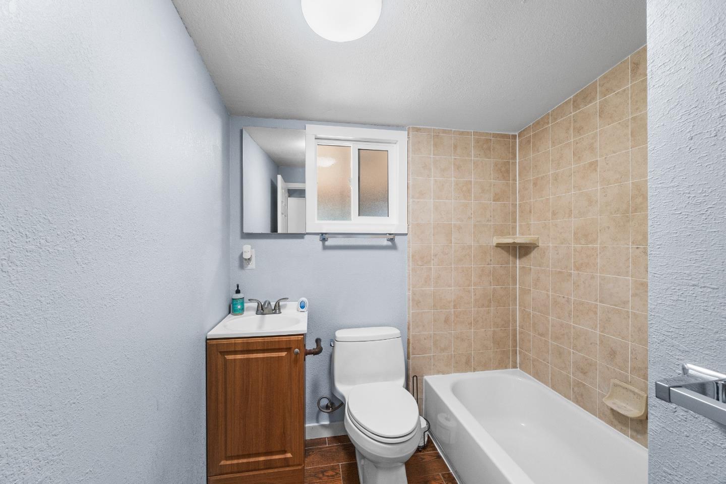 15666 Kings Creek Road Boulder Creek, CA 95006 - Photo 16 of 40 a white toilet sitting next to a bathroom sink and vanity