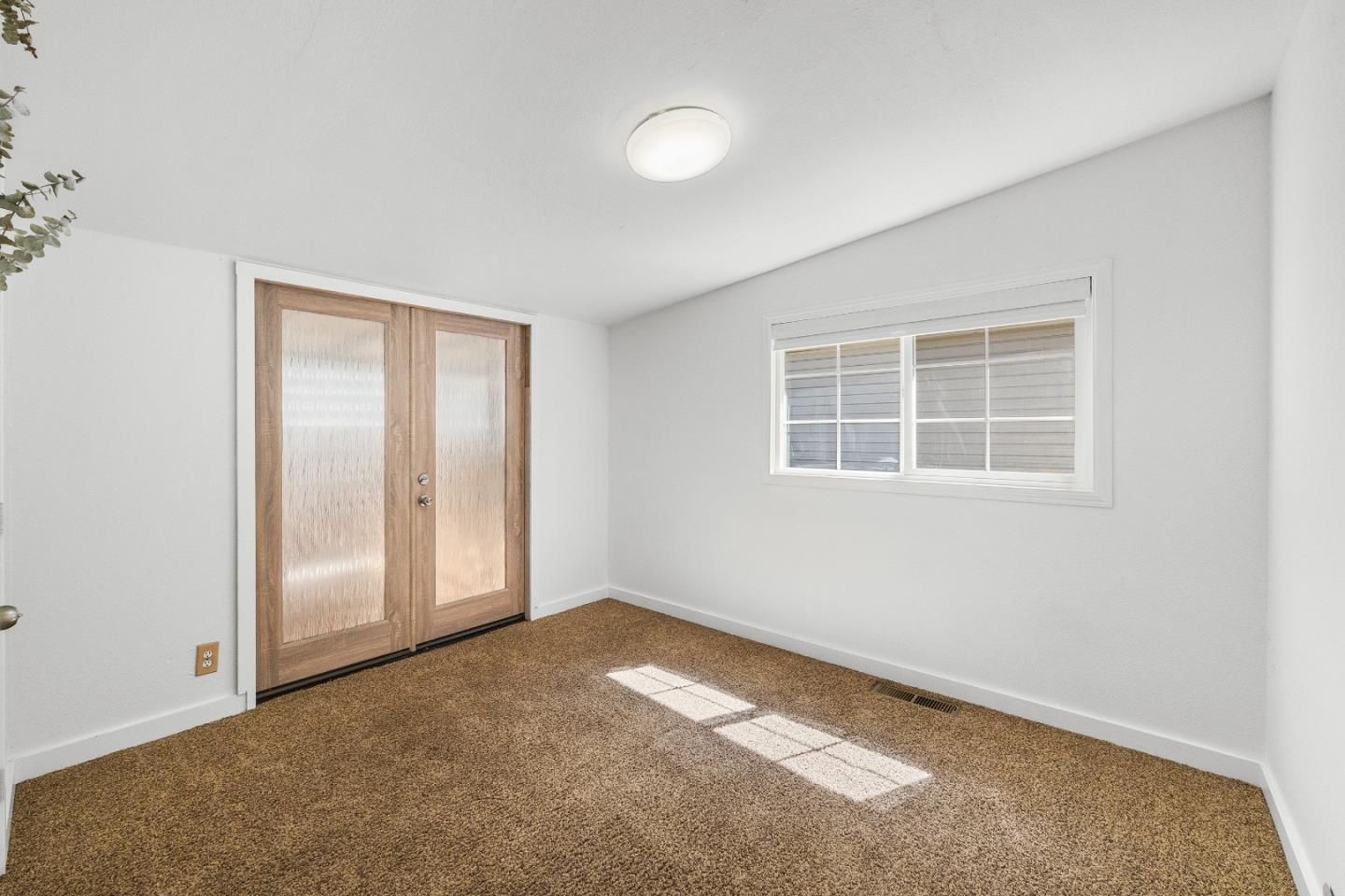 15666 Kings Creek Road Boulder Creek, CA 95006 - Photo 18 of 40 an empty room with windows and closet