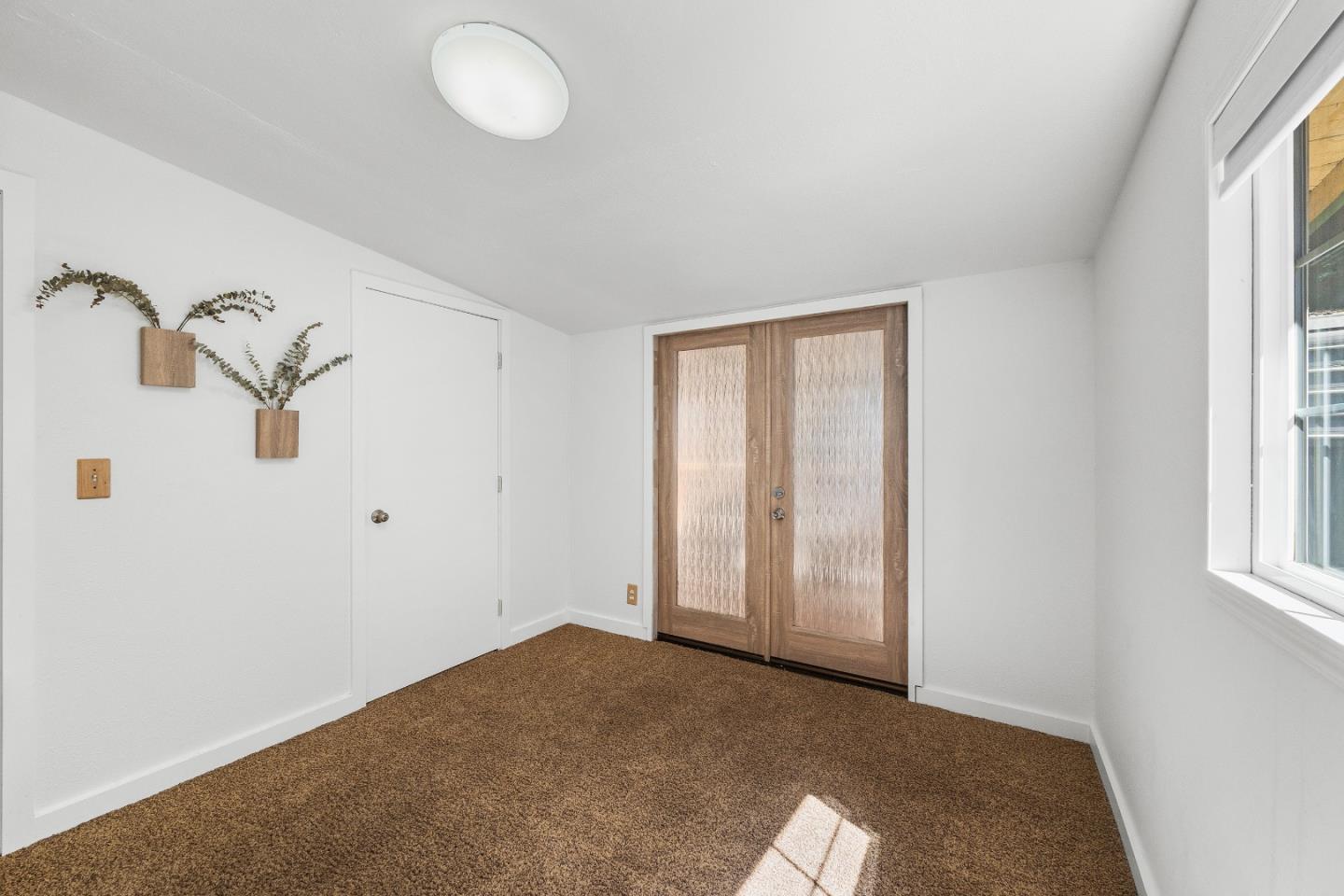 15666 Kings Creek Road Boulder Creek, CA 95006 - Photo 19 of 40 an empty room with windows