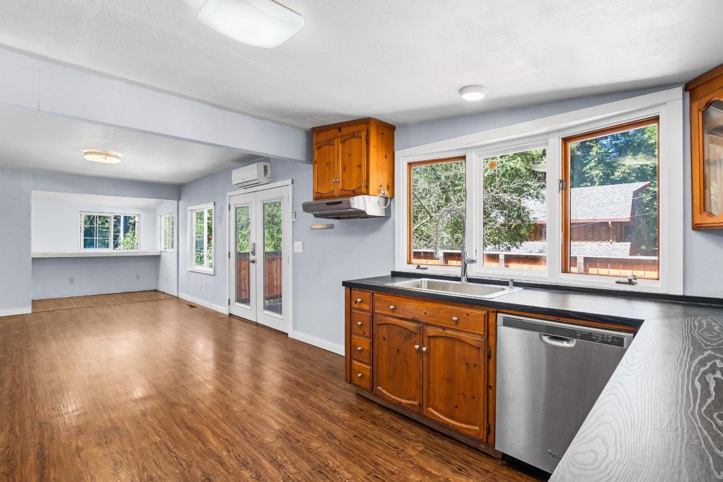 15666 Kings Creek Road Boulder Creek, CA 95006 - Photo 2 of 40 a kitchen with wooden floors and a window