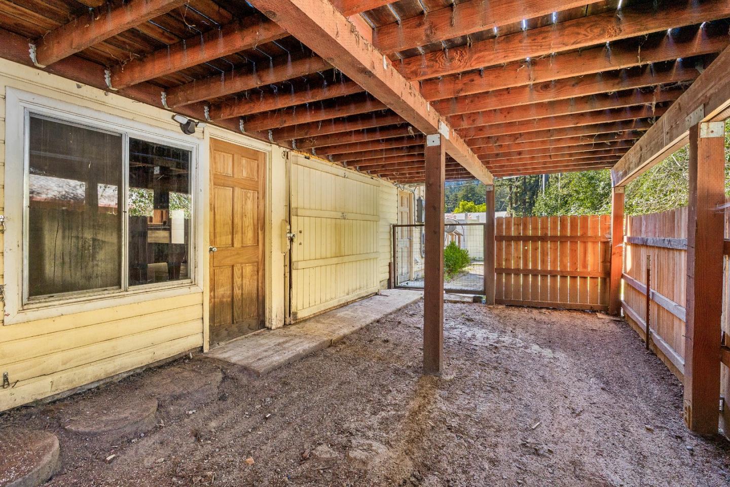 15666 Kings Creek Road Boulder Creek, CA 95006 - Photo 23 of 40 a view of a backyard with wooden fence