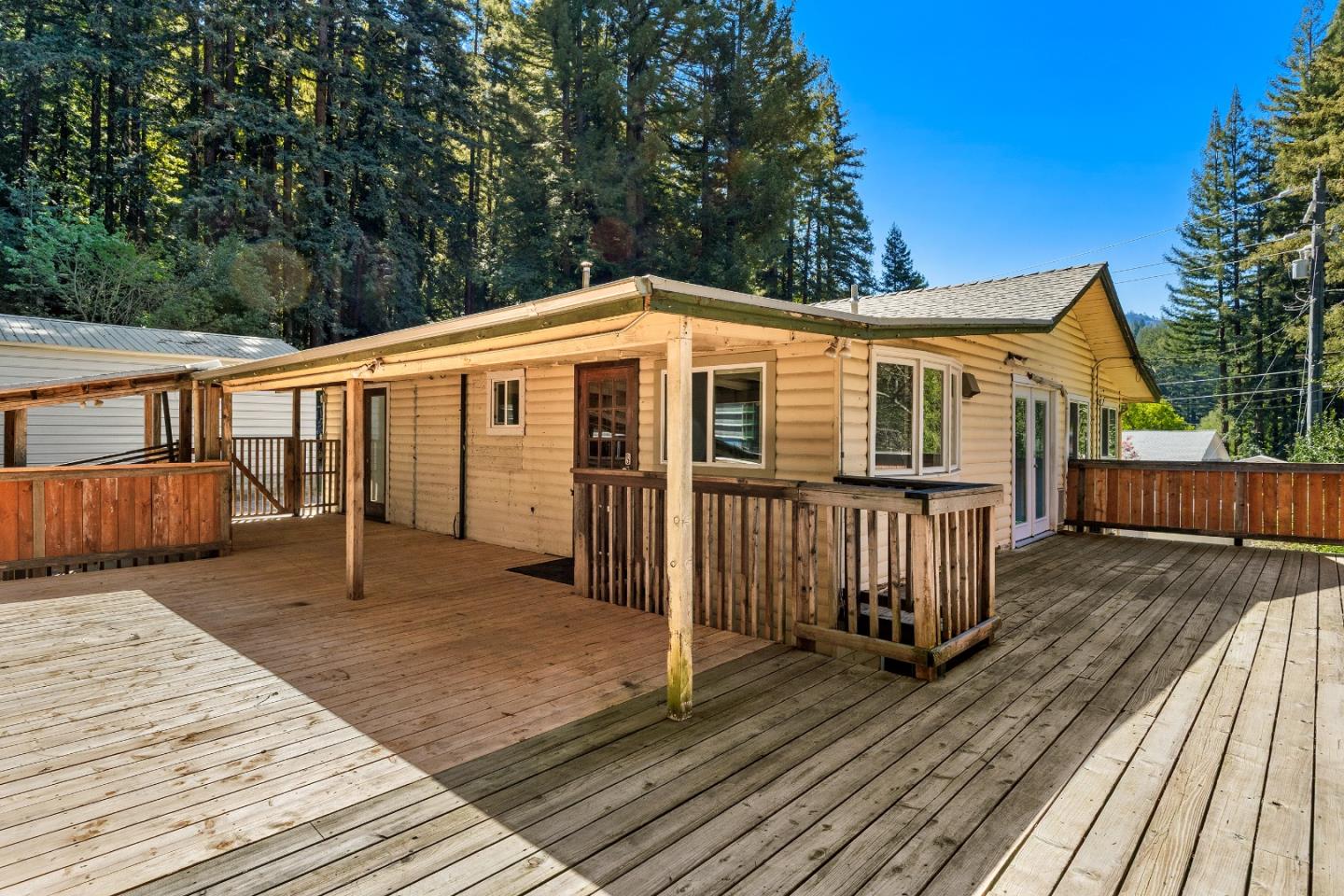 15666 Kings Creek Road Boulder Creek, CA 95006 - Photo 26 of 40 a front view of a house with a yard