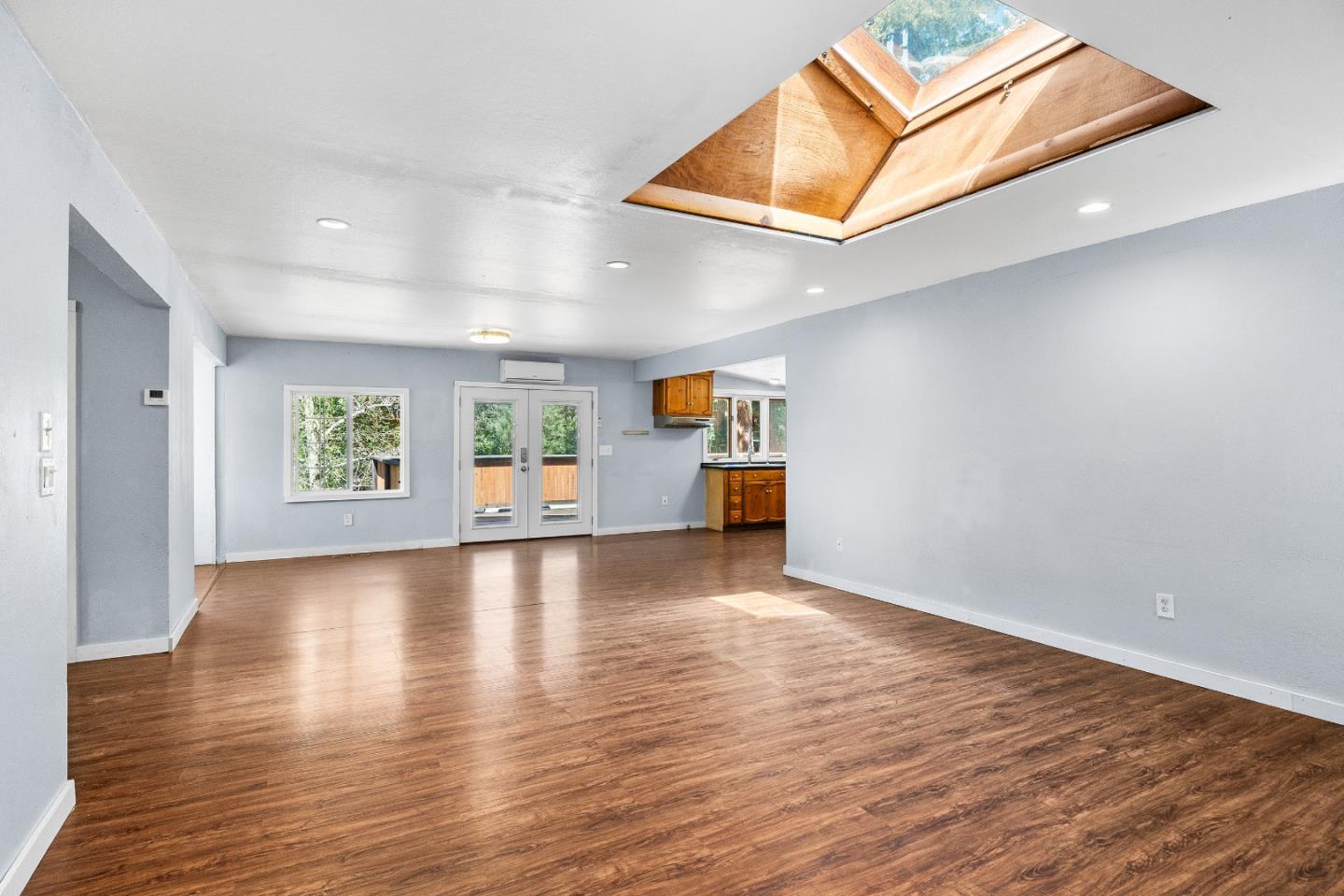 15666 Kings Creek Road Boulder Creek, CA 95006 - Photo 8 of 40 a view of an empty room and wooden floor