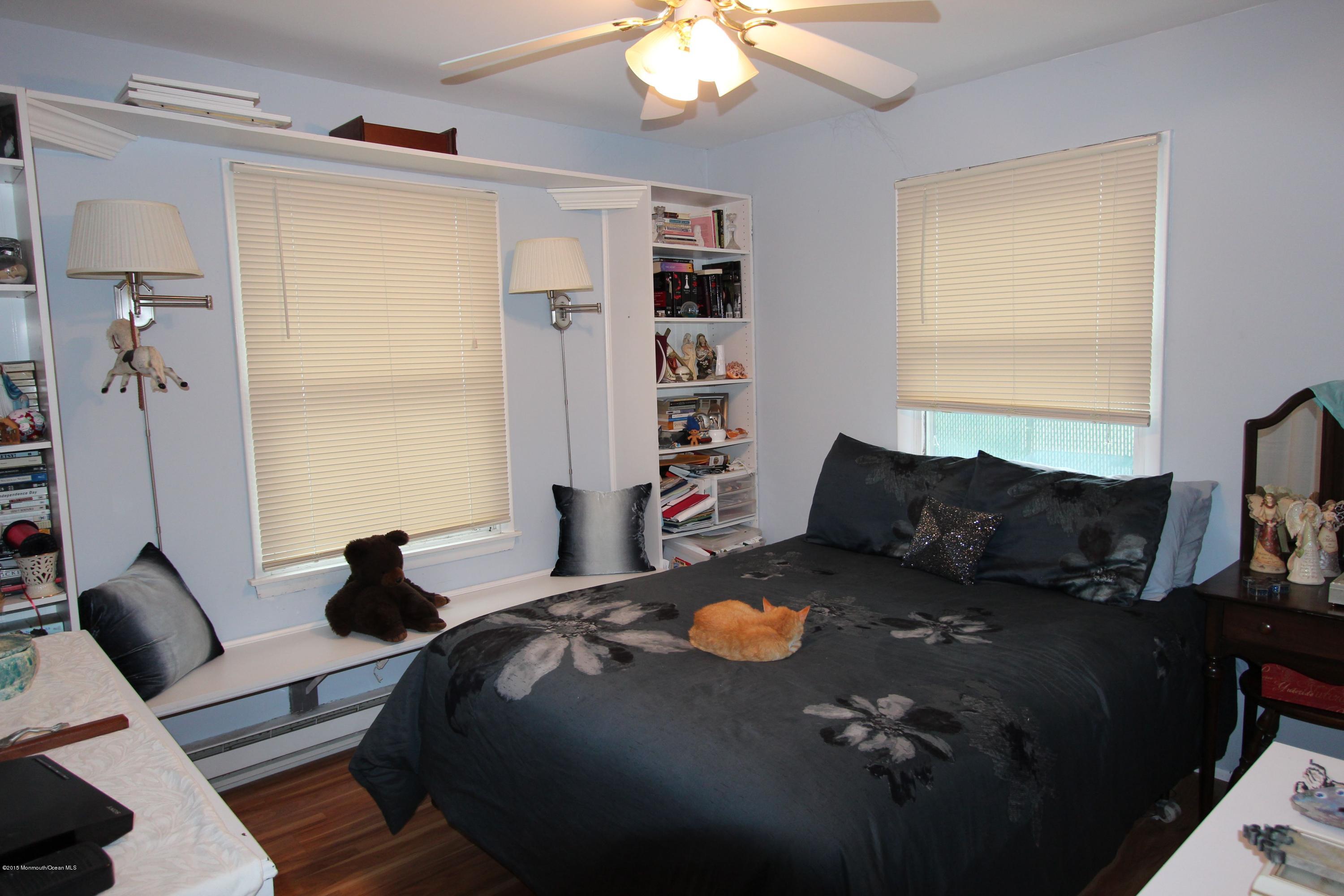 188 Stowaway Road Manahawkin, NJ 08050 - Photo 12 of 18 a bed sitting in a bedroom next to a window