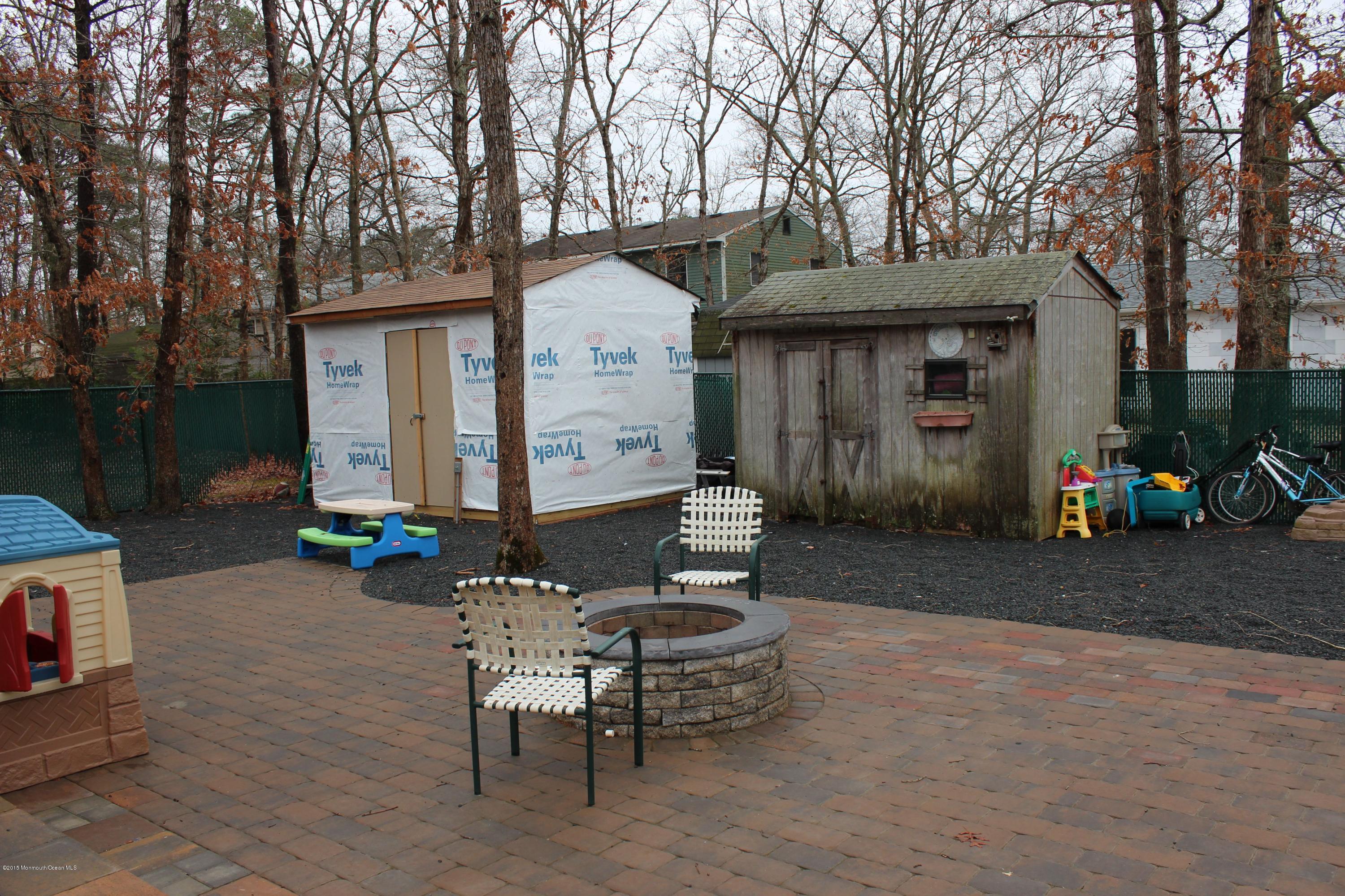 188 Stowaway Road Manahawkin, NJ 08050 - Photo 15 of 18 a view of a house with backyard and sitting area