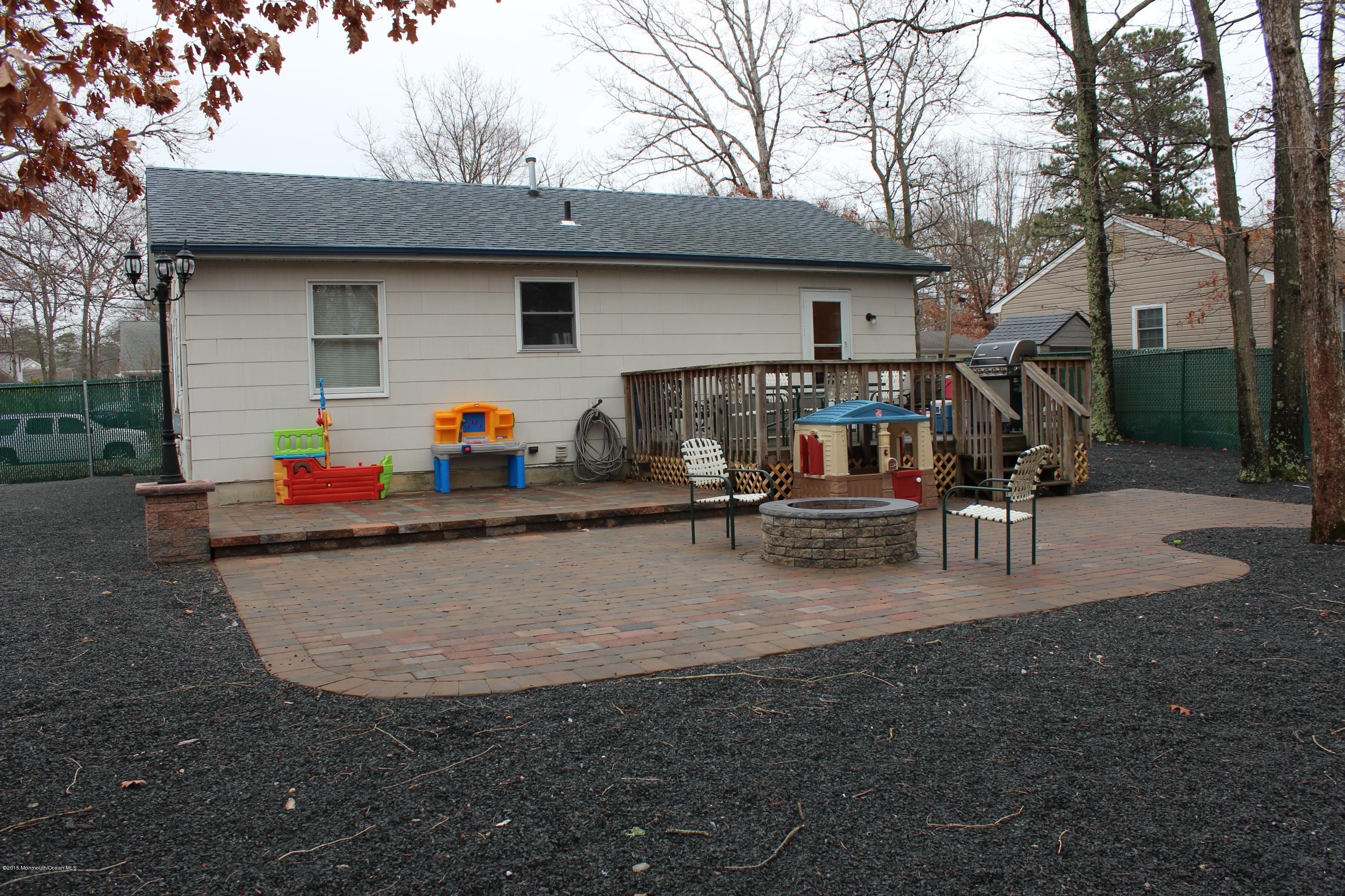 188 Stowaway Road Manahawkin, NJ 08050 - Photo 17 of 18 a view of a house with backyard and sitting area