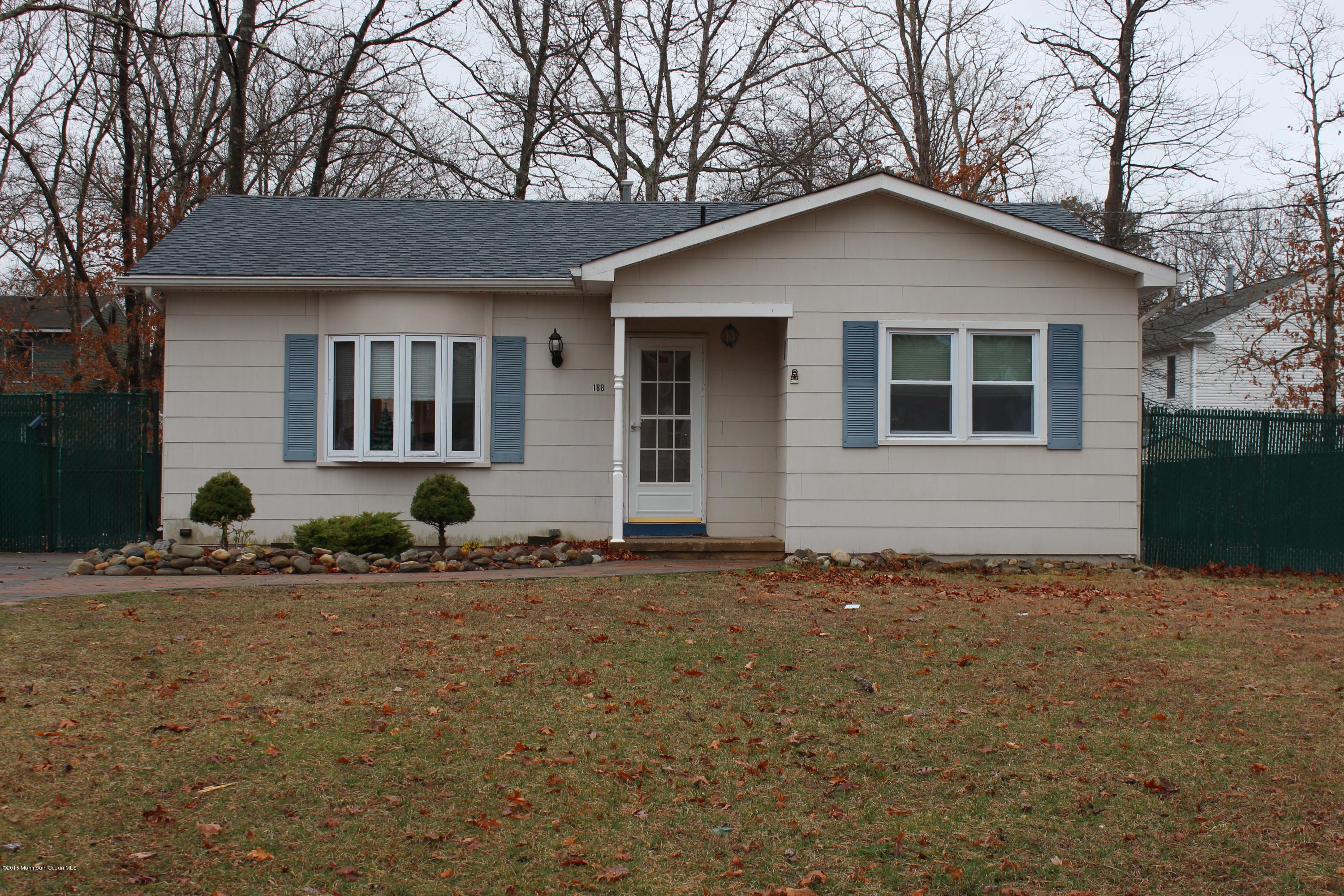188 Stowaway Road Manahawkin, NJ 08050 - Photo 2 of 18 a front view of a house with a yard