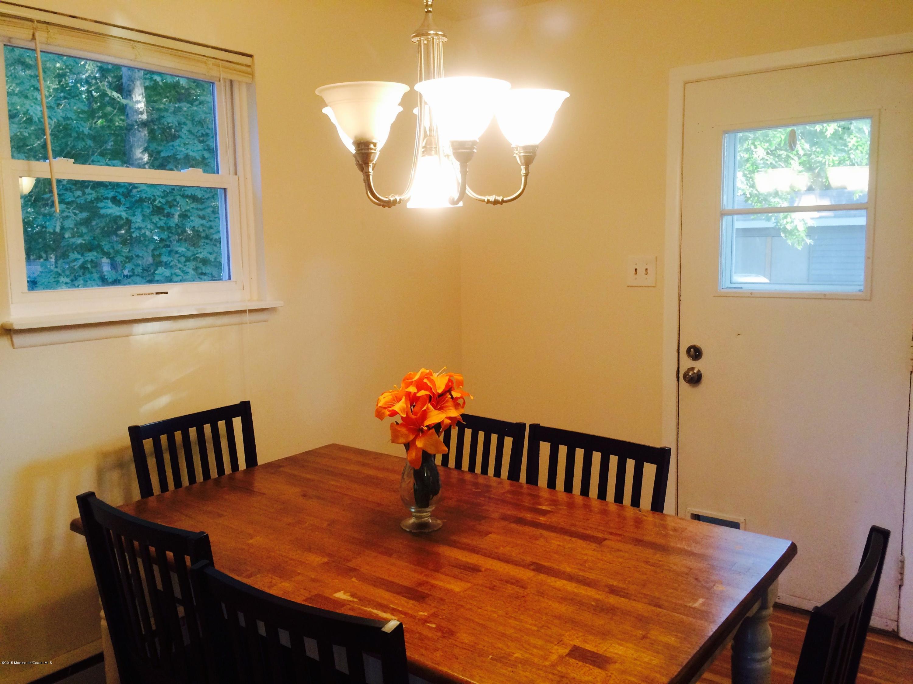 188 Stowaway Road Manahawkin, NJ 08050 - Photo 5 of 18 a view of a dining room with furniture window and outside view