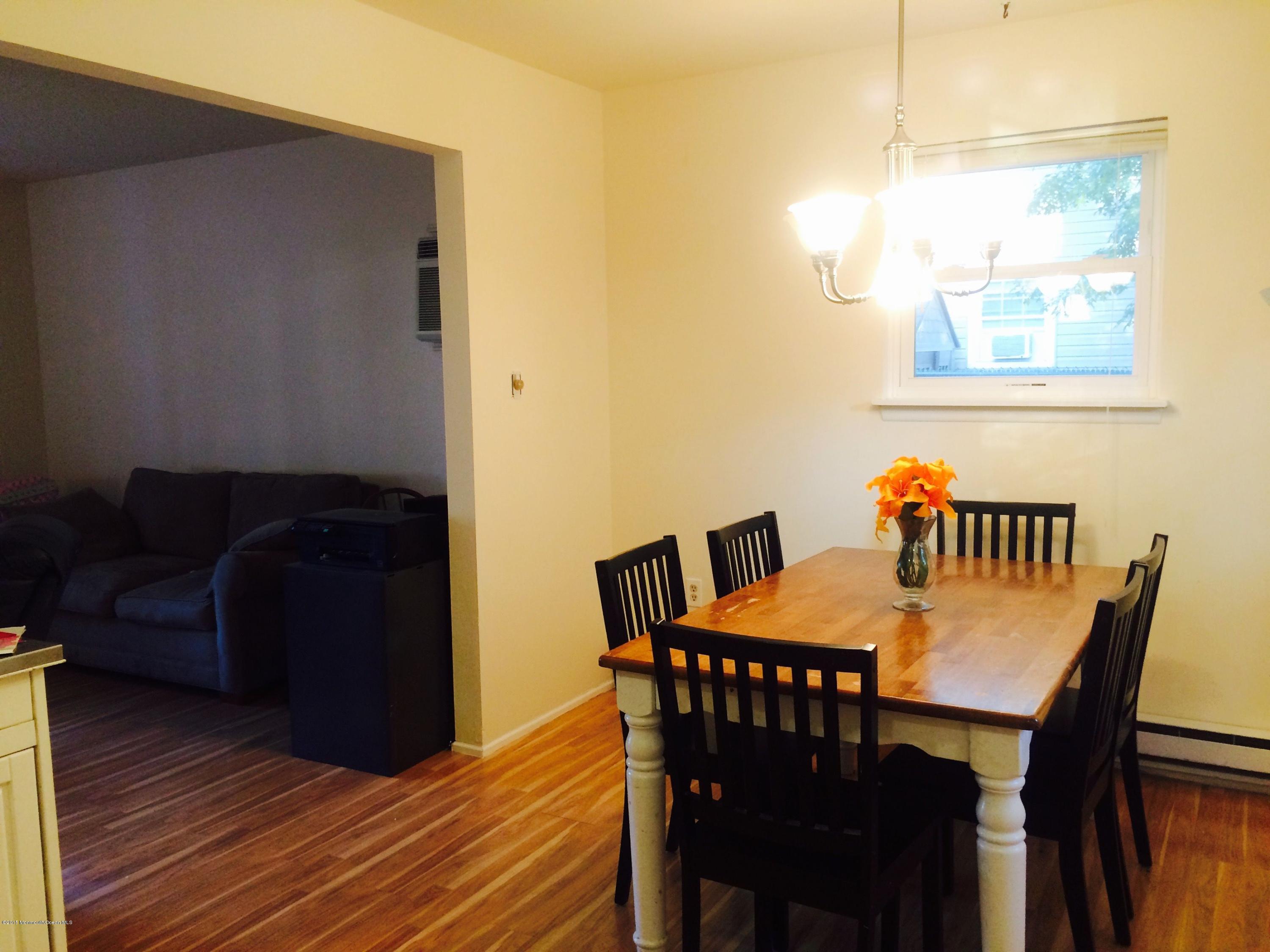 188 Stowaway Road Manahawkin, NJ 08050 - Photo 6 of 18 a view of a dining room with furniture and wooden floor