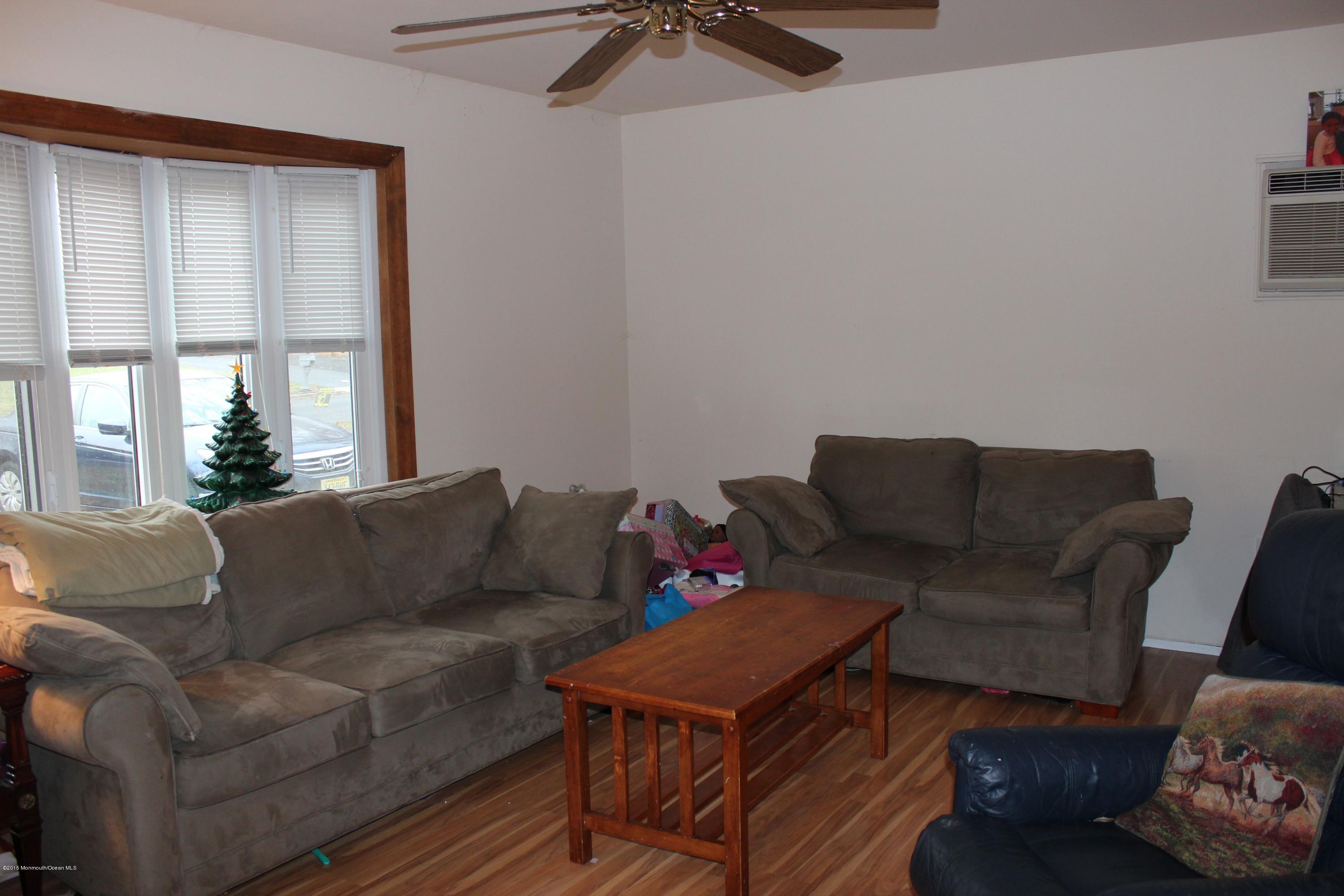 188 Stowaway Road Manahawkin, NJ 08050 - Photo 9 of 18 a living room with furniture and a window