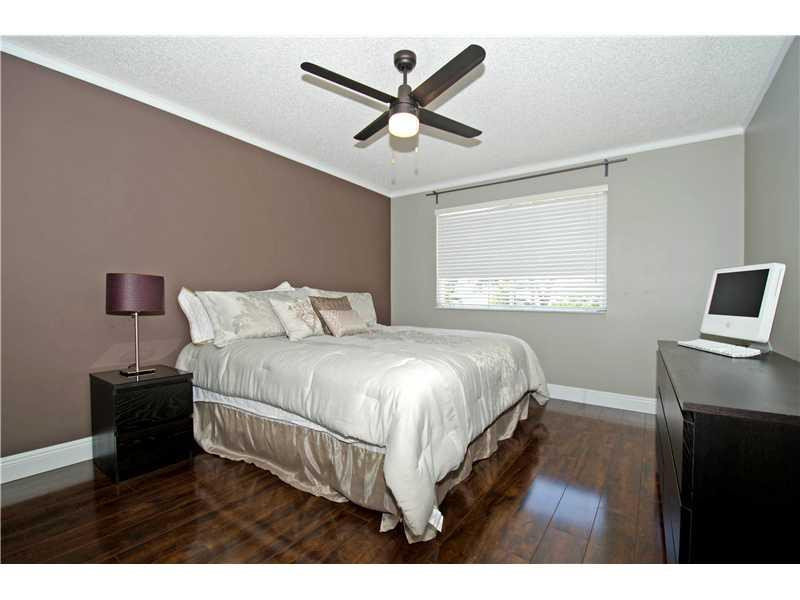 10096 Country Brook Road Boca Raton, FL 33428 - Photo 11 of 29 a bedroom with a bed and a window
