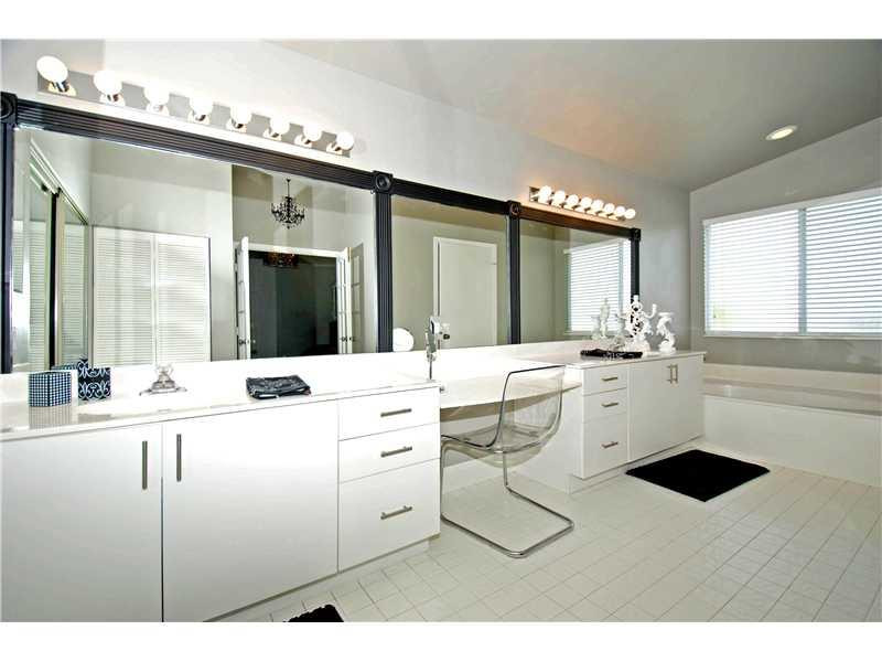 10096 Country Brook Road Boca Raton, FL 33428 - Photo 13 of 29 a room with a sink and cabinets