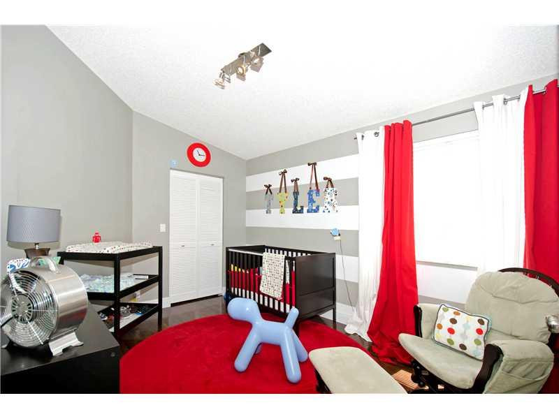 10096 Country Brook Road Boca Raton, FL 33428 - Photo 15 of 29 a bedroom with furniture and a chair