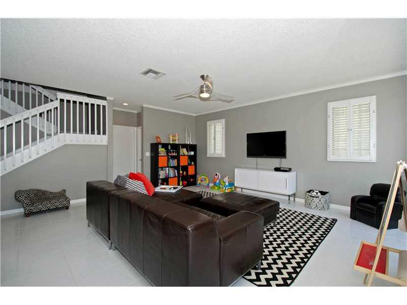 10096 Country Brook Road Boca Raton, FL 33428 - Photo 20 of 29 a bedroom with furniture and a flat screen tv