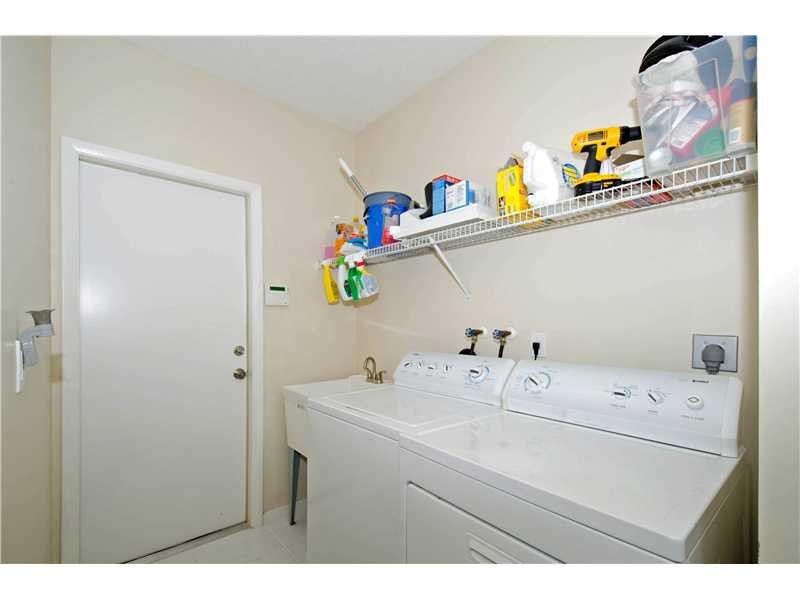 10096 Country Brook Road Boca Raton, FL 33428 - Photo 23 of 29 a bathroom with a sink a vanity and a mirror